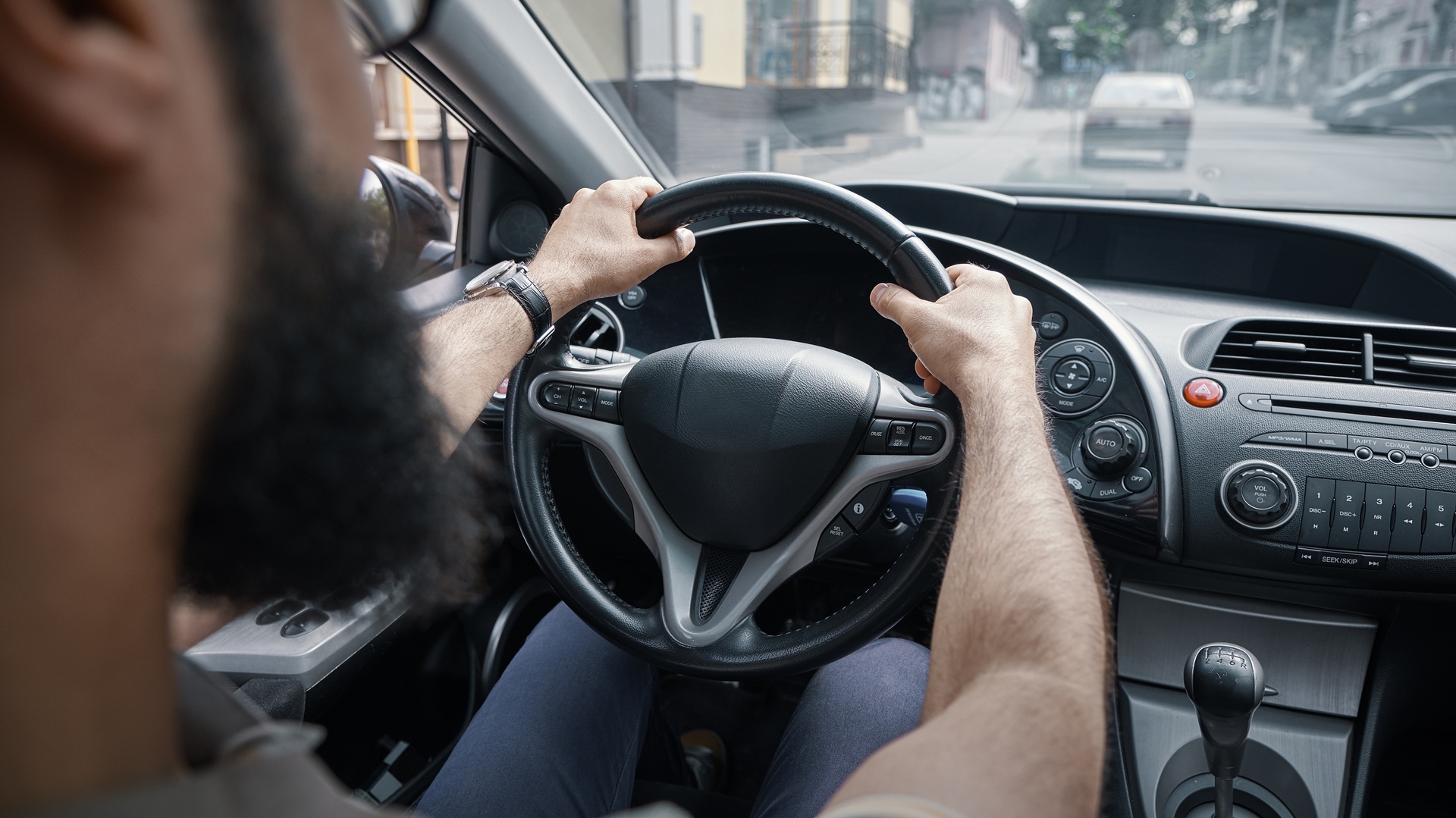 Man driving and watching the road